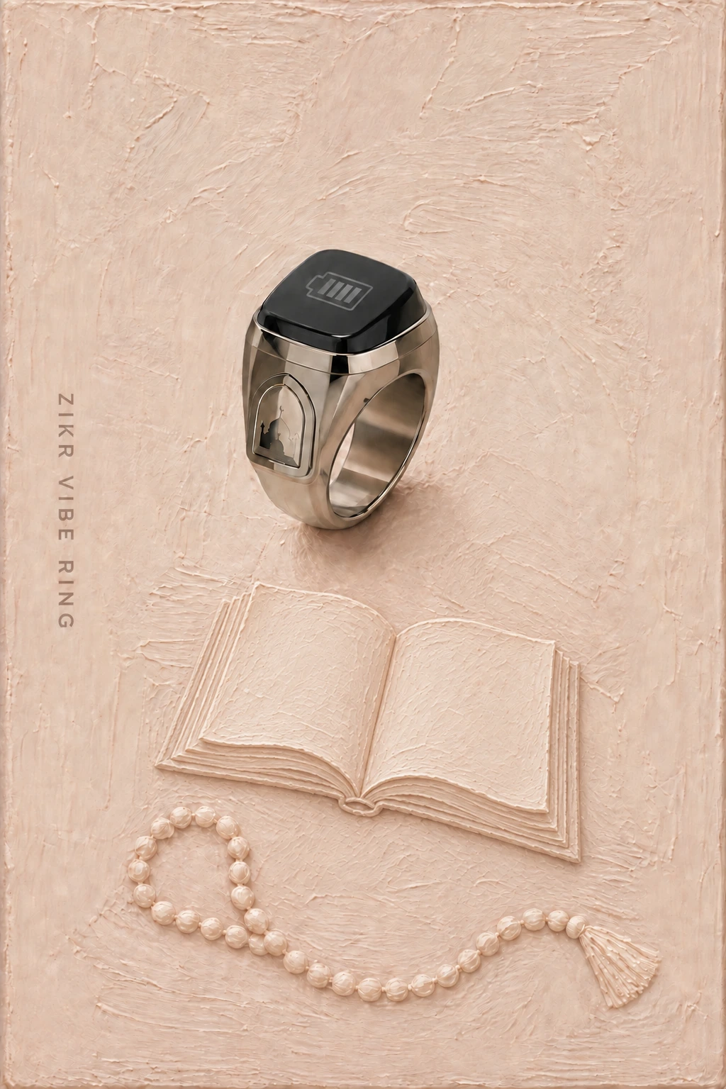 Zikr Vibe Ring on a warm cream-beige painted background with a plain open book and beads